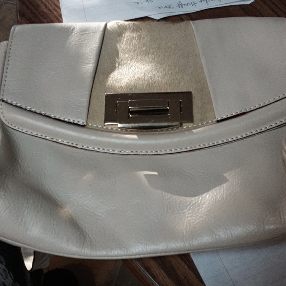 Cream colored italian leather tre vero purse.